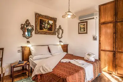 Letto o letti in una camera di Hotel Garden