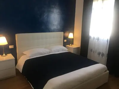 Letto o letti in una camera di Blue Sea Rooms Apartment Cagliari