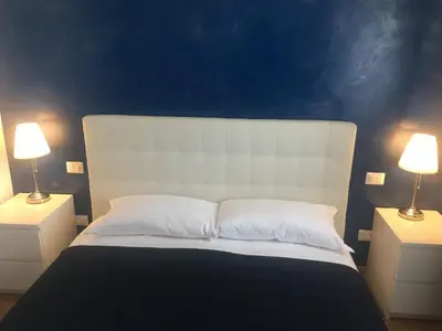 Letto o letti in una camera di Blue Sea Rooms Apartment Cagliari