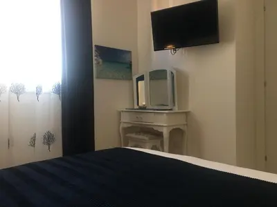 TV o dispositivi per l'intrattenimento presso Blue Sea Rooms Apartment Cagliari