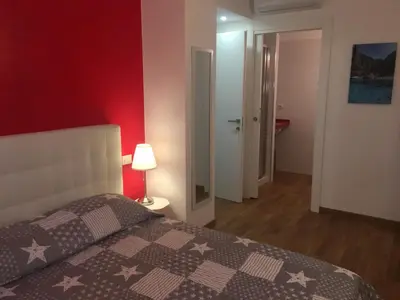 Letto o letti in una camera di Blue Sea Rooms Apartment Cagliari