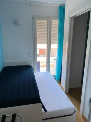 Letto o letti in una camera di Blue Sea Rooms Apartment Cagliari
