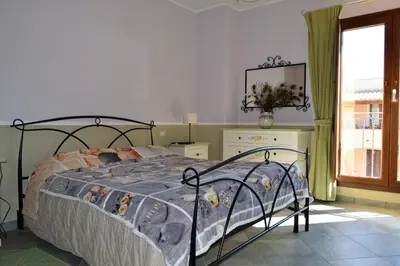 Letto o letti in una camera di Sa VillaRose By La Via Del Mare Viaggi e Vacanze