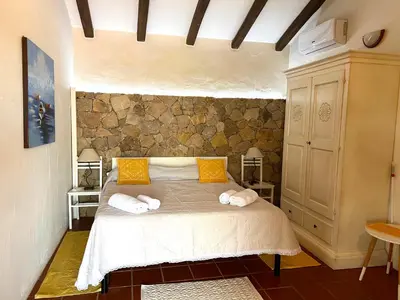 Letto o letti in una camera di Antico Casale del Poggio