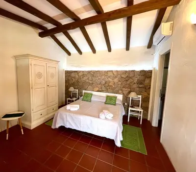 Letto o letti in una camera di Antico Casale del Poggio