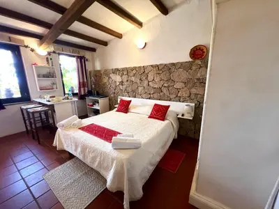 Letto o letti in una camera di Antico Casale del Poggio