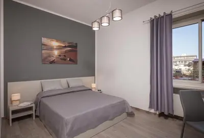 Letto o letti in una camera di Ajana Rooms by Accomodo