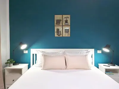 Letto o letti in una camera di Ajana Rooms by Accomodo