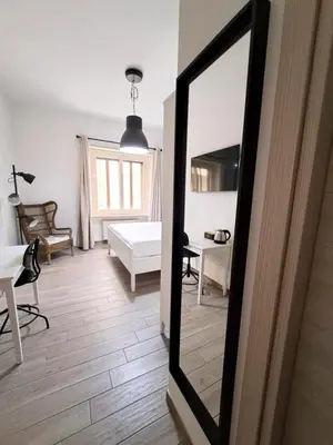 Letto o letti in una camera di Ajana Rooms by Accomodo