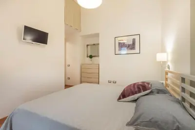 Letto o letti in una camera di Helmi34 - Appartamento dotato di tutti i comfort nel centro di Cagliari