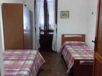 Letto o letti in una camera di Appartamento Con Splendida Vista Mare