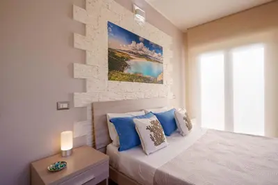 Letto o letti in una camera di Cagliari Magica bellissimo appartamento & suite in centro
