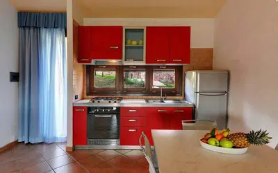 Cucina o angolo cottura di Residence Il Borgo di Porto Corallo