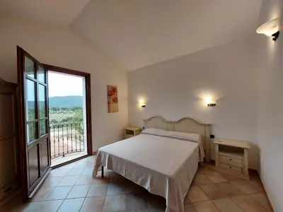 Letto o letti in una camera di Hotel La Corte Rosada