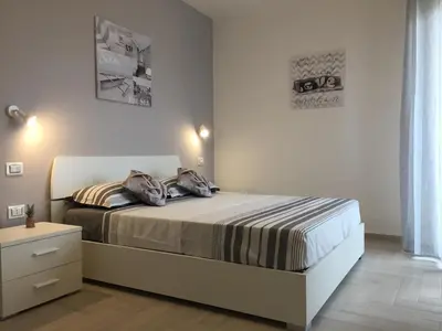 Letto o letti in una camera di Le Domus Modern Apartments Cagliari