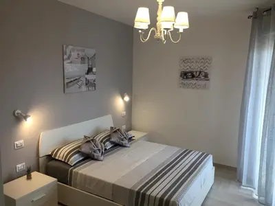 Letto o letti in una camera di Le Domus Modern Apartments Cagliari