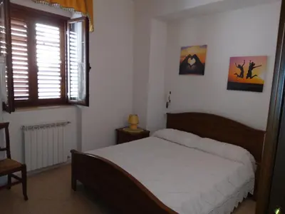 Letto o letti in una camera di Appartamento con Barbecue