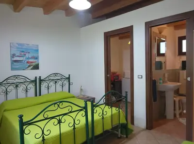 Letto o letti in una camera di Sa Stella E Monti