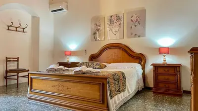 Letto o letti in una camera di Casa Nina