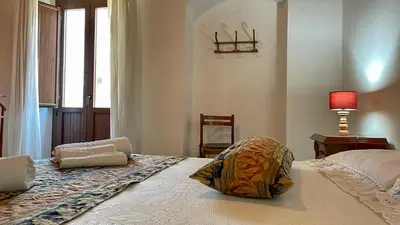 Letto o letti in una camera di Casa Nina