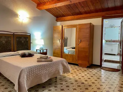 Letto o letti in una camera di Casa Nina