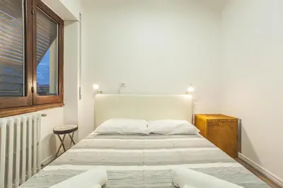 Letto o letti in una camera di Le stanze al PORTO