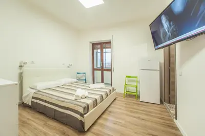 Letto o letti in una camera di Le stanze al PORTO