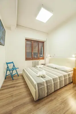 Letto o letti in una camera di Le stanze al PORTO