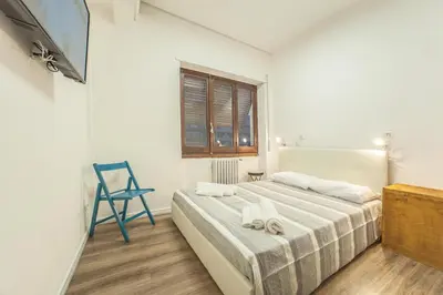 Letto o letti in una camera di Le stanze al PORTO