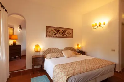 Letto o letti in una camera di Nora Club Hotel & Spa
