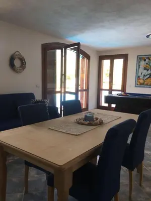 Area soggiorno di VILLA VITTORIA with LARGE PRIVATE HEATED SWIMMING POOL COMPLETE with JACUZZI FOR EXCLUSIVE USE , SEA and BEACH VIEW, 150 METERS FROM THE BEACH, POOL SURFACE 60 mq , 645 sq ft, POOL DEPTH 140 cm ,55 inches, PARKING AND WIFI FREE