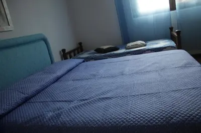 Letto o letti in una camera di Casa vacanze Piscinas