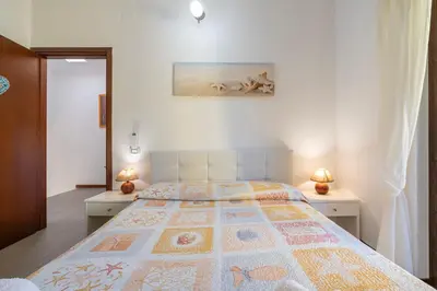 Letto o letti in una camera di Villa Veronica Villasimius
