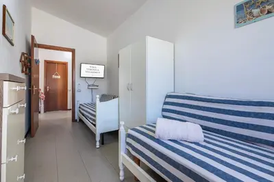 Letto o letti in una camera di Villa Veronica Villasimius