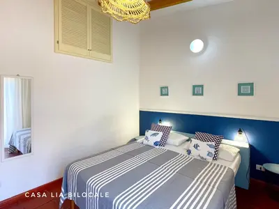 Letto o letti in una camera di Casa Lia