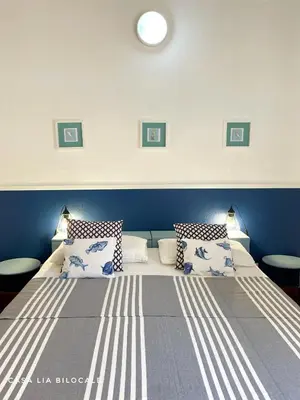 Letto o letti in una camera di Casa Lia