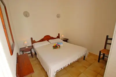Letto o letti in una camera di Villetta con giardino a due passi dal mare