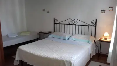 Letto o letti in una camera di B&B Is Camminantis