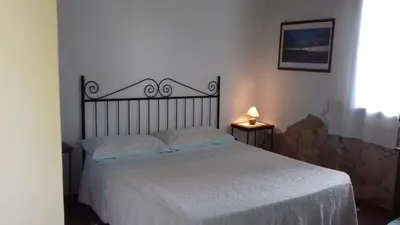 Letto o letti in una camera di B&B Is Camminantis