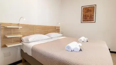 Letto o letti in una camera di Affittacamere Juighissa Leonora