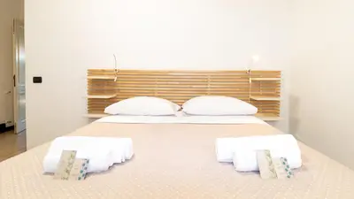 Letto o letti in una camera di Affittacamere Juighissa Leonora