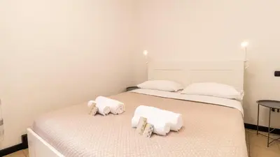 Letto o letti in una camera di Affittacamere Juighissa Leonora