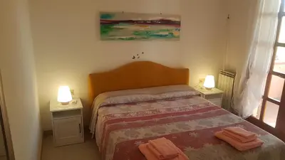 Letto o letti in una camera di La Vigna For Family