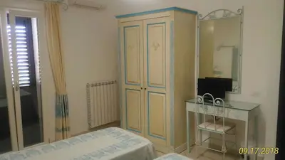 Letto o letti in una camera di B&B Madau