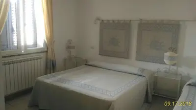 Letto o letti in una camera di B&B Madau