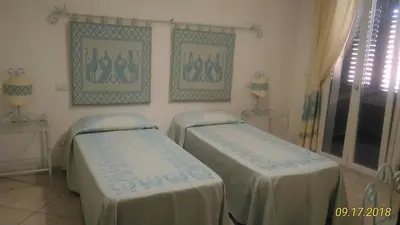 Letto o letti in una camera di B&B Madau