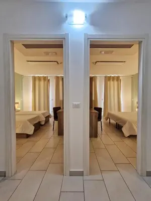 Letto o letti in una camera di Mansio Residence & Hotel