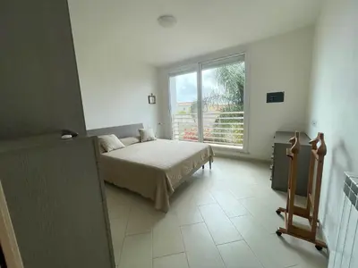 Letto o letti in una camera di I Giardini di Pula 
