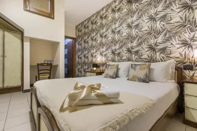 Letto o letti in una camera di Arcobaleno Rooms