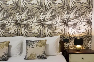Letto o letti in una camera di Arcobaleno Rooms